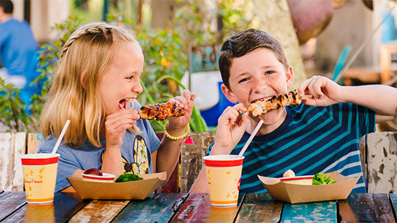 Children enjoying a meal at Harambe Market in Disney’s Animal Kingdom